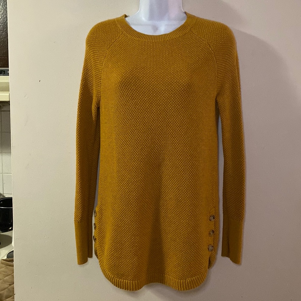 This item is an orange sweater, great for winter. Long.